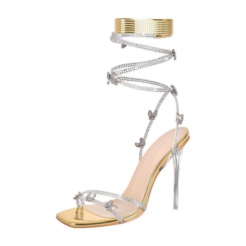 LISHAN Women's Rhinestone Studded Gladiator Lace-Up Clear High Heels — Faux Patent Leather Gold